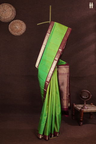 Kanchipuram Silk Saree In Parrot Green With Floral Buttas