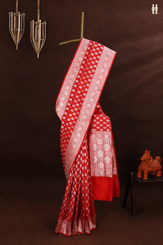 Banarasi Silk Saree In Scarlet Red With Floral Buttas