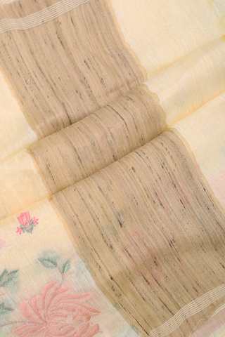 Linen Saree In Pale Yellow With Floral Embroidered Motifs