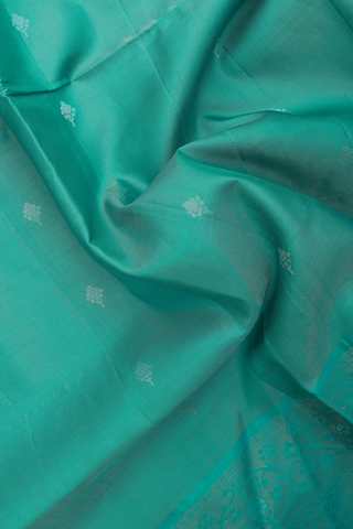 Soft Silk Saree In Green With Zari Buttas