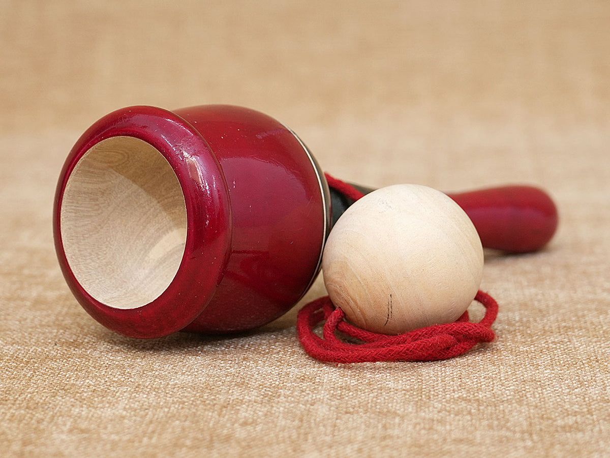 Wooden Child Playing Gilly Ball