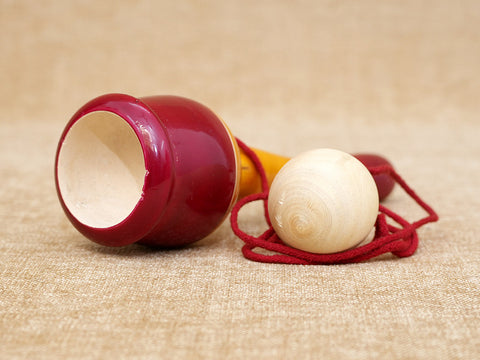 Wooden Child Playing Gilly Ball